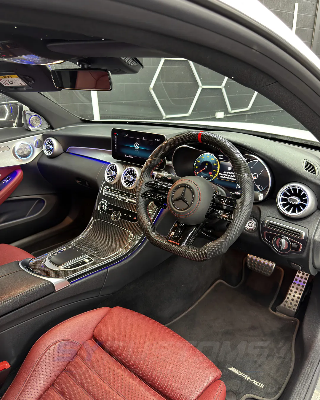 Mercedes C-Class Coupe (Facelift) after oem ambient lighting, custom steering wheel, car accessories, starlight installation