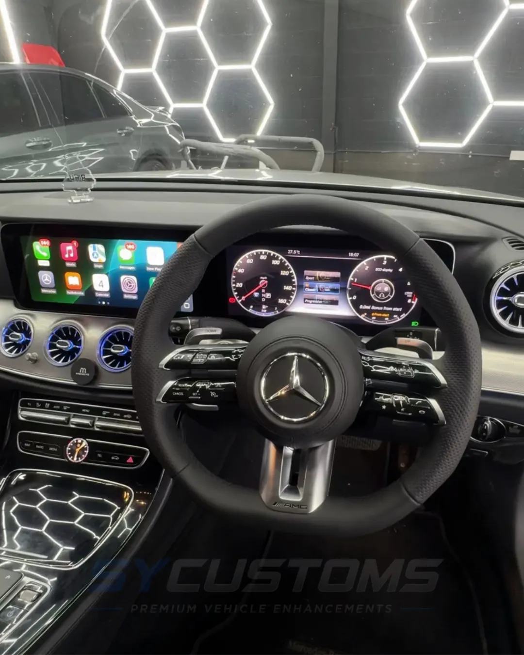 Mercedes E-Class after oem retrofits, oem ambient lighting, car accessories, custom steering wheel installation
