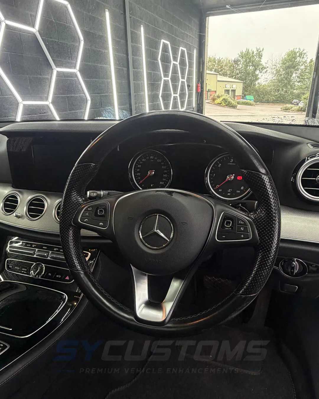 Mercedes E-Class before oem retrofits, oem ambient lighting, car accessories, custom steering wheel installation